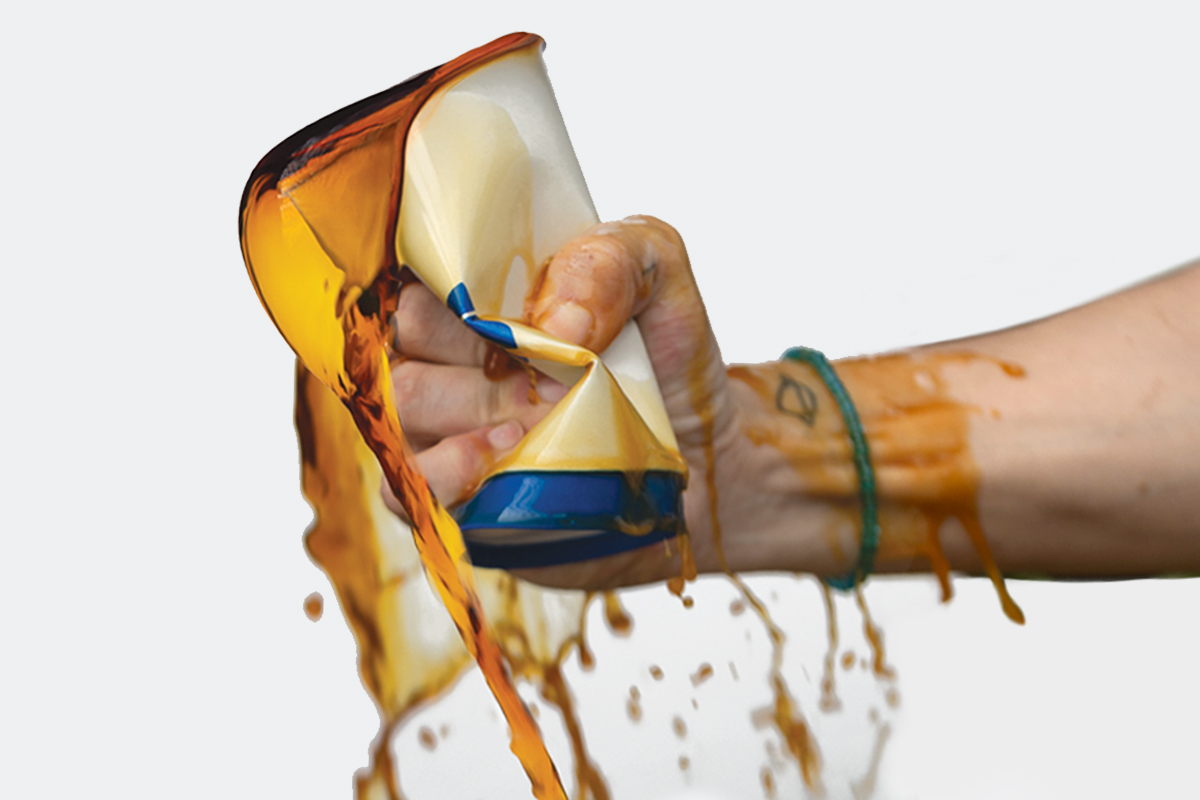 Hand squeezing a cup of coffee