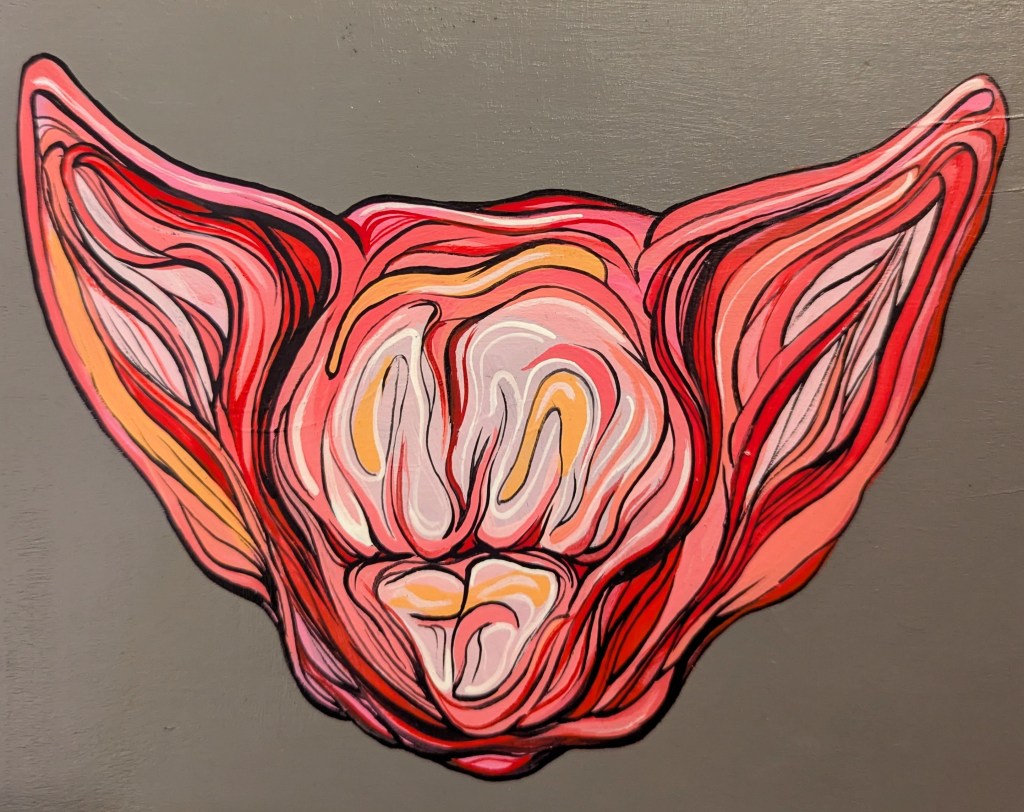 A painting of a feline-like orange, red and pink head on a gray background.