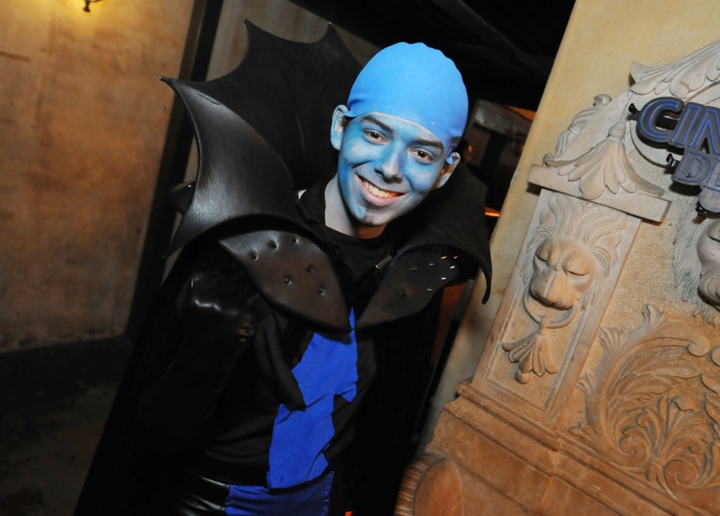 A young adult male dressed in a Megamind costume.