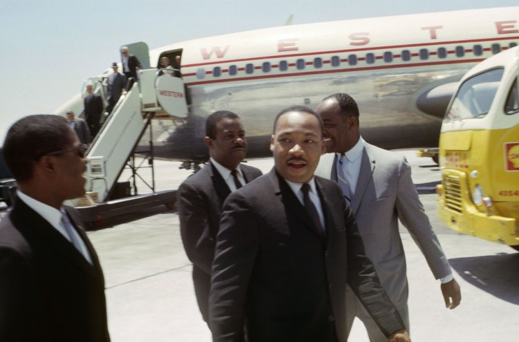 Martin Luther King and his supporters debaord an airplane at Phoenix Sky Harbor Airport in 1964.