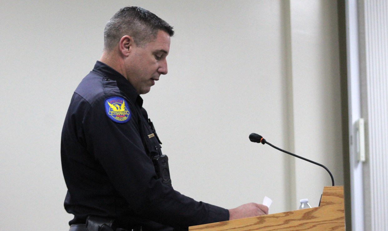 a man in a phoenix police officer uniform