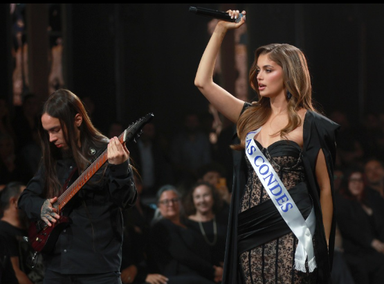 Fernández captivates with a powerful on-stage performance, fusing beauty pageant grace and death metal edge.