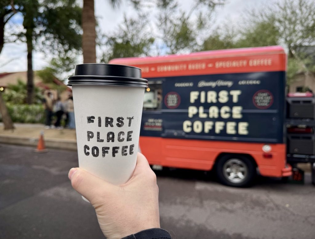 A cup of coffee in a to-go cup.