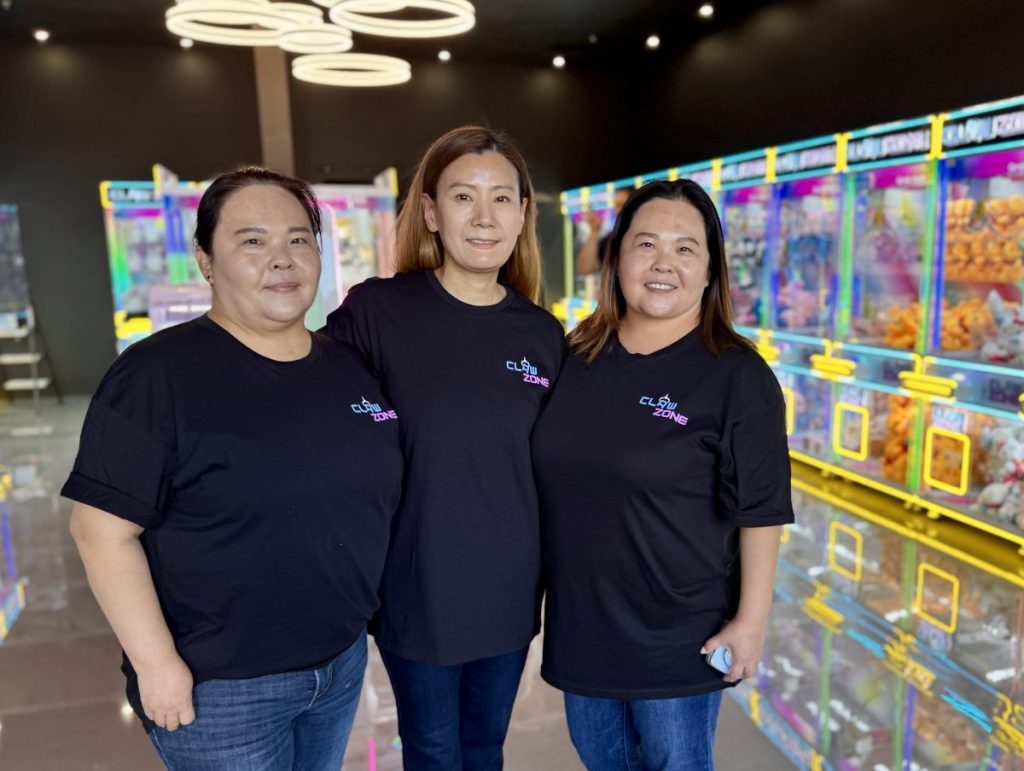 Three owners of Claw Zone stand in their arcade