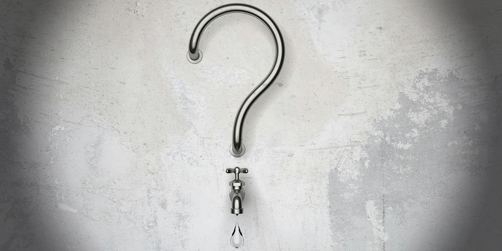 a faucet shaped to look like a question mark