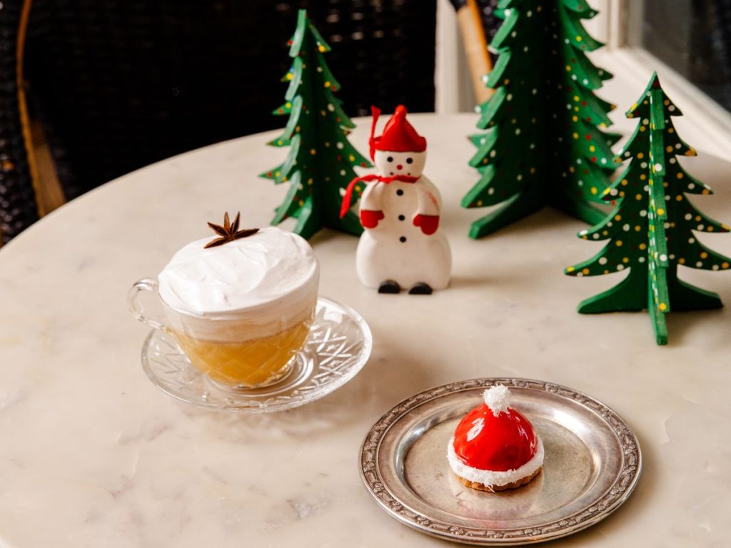 A hot holiday cocktail and Santa hat-inspired dessert.