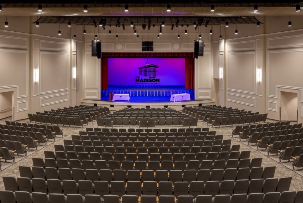 The interior and stage of an indoor theater.