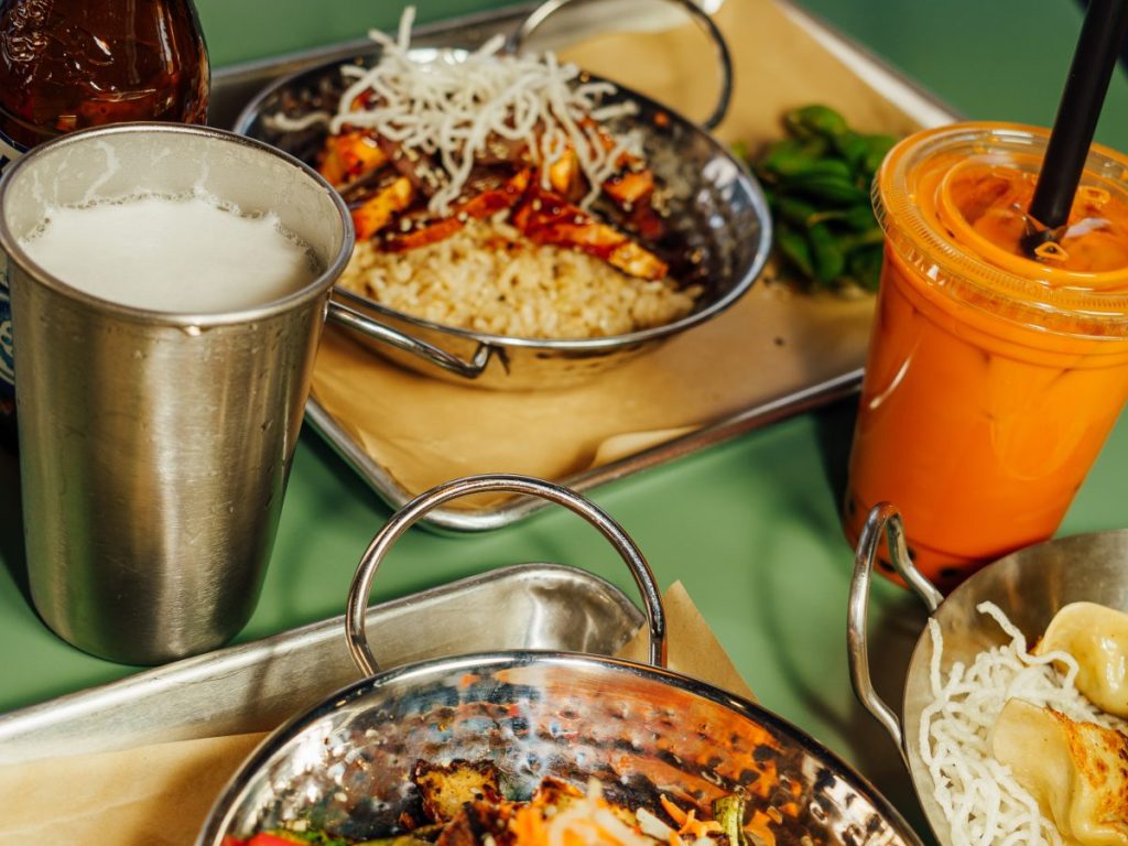 Platters of Asian food and drinks.