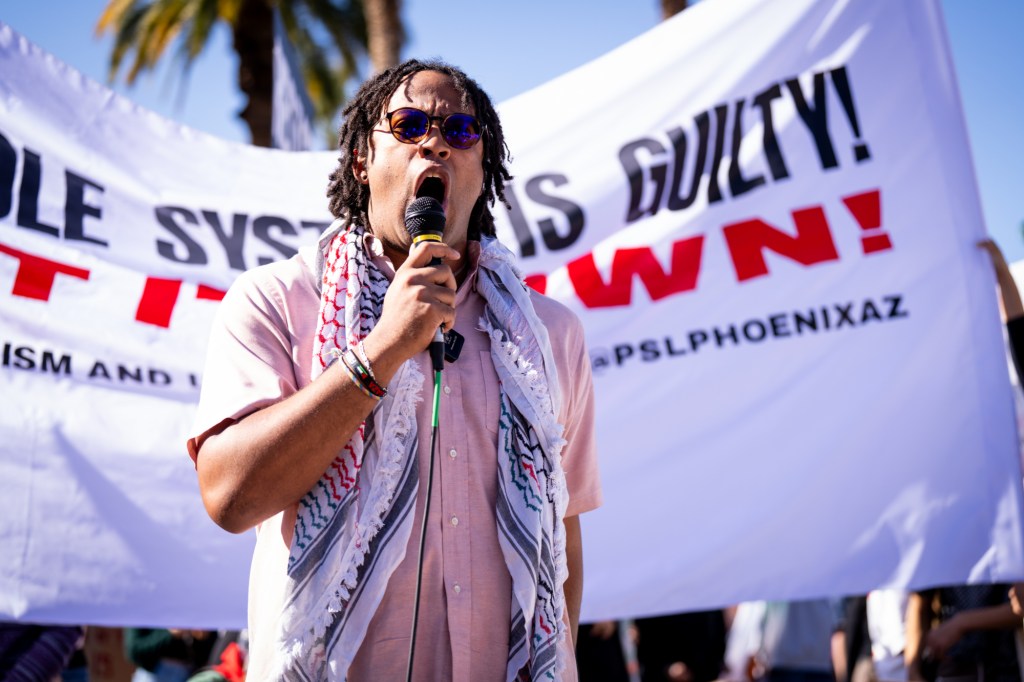 protesters at an anti-ice rally