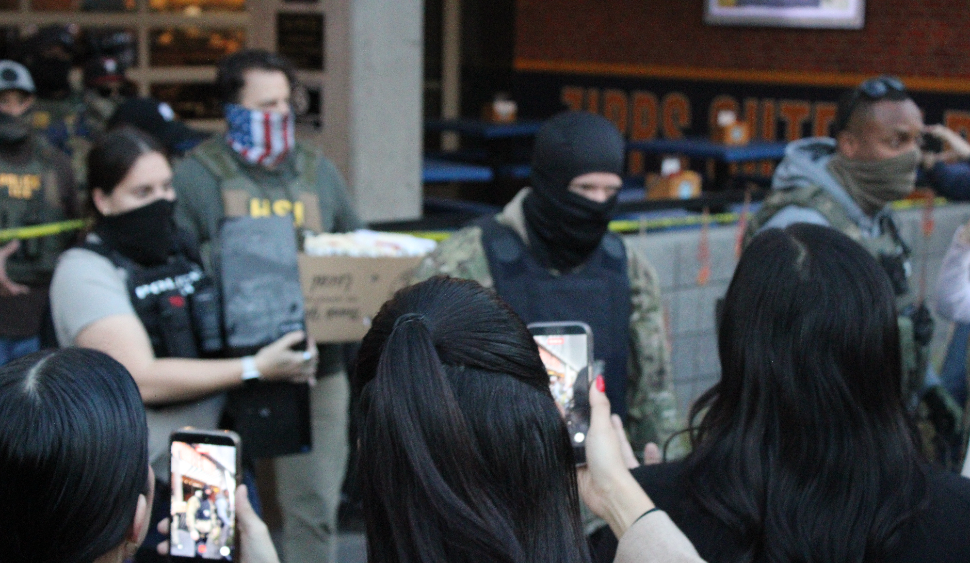 protesters film ice agents