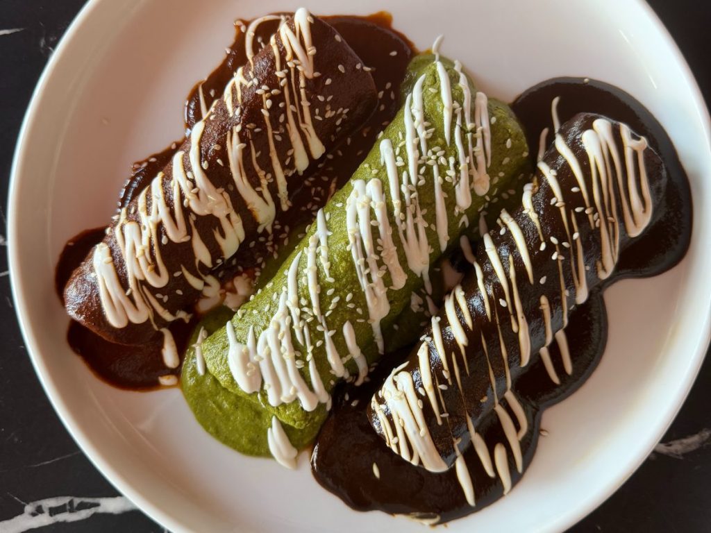 A trio of enchiladas.