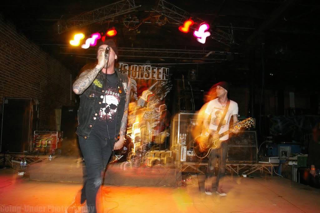 Punk band The Unseen on stage during a show.