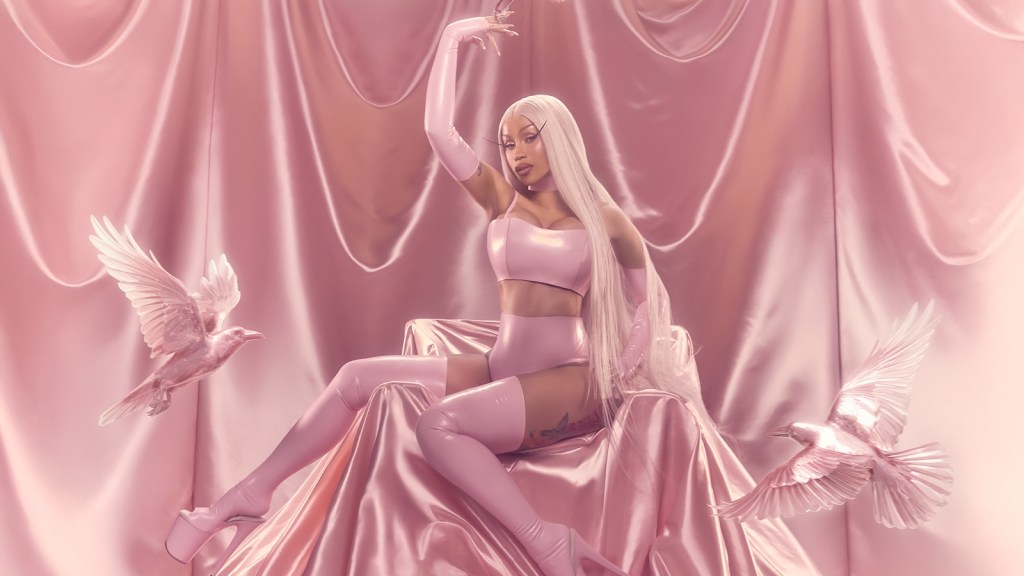 Cardi B poses in a pink promotional image for her current tour.