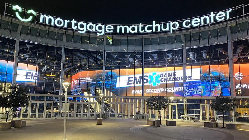 A nighttime exterior view of Mortgage Matchup Center in Phoenix.