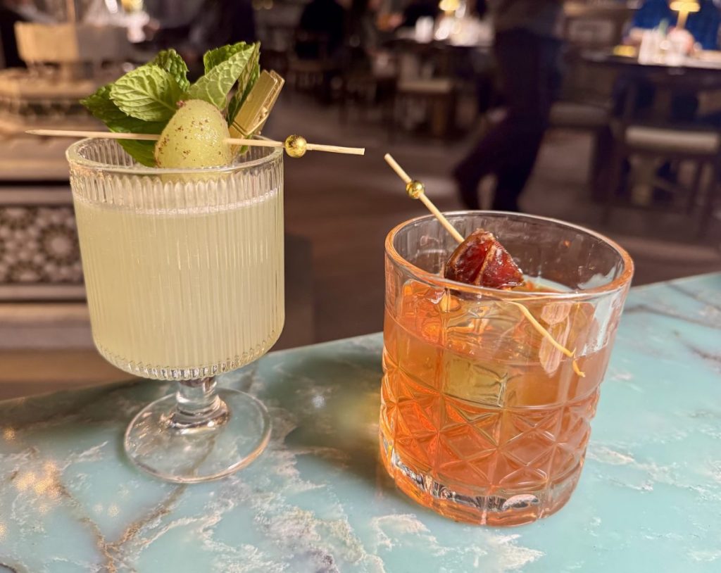 Two cocktails on a table.