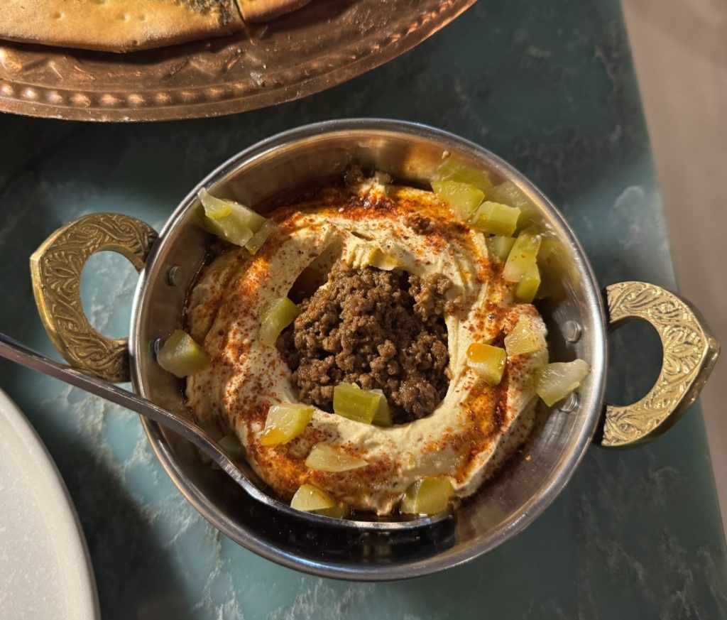 A small bowl of hummus