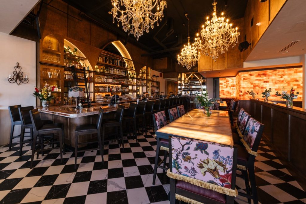 A moody bar with a Himalayan salt brick wall.