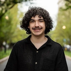 dante dallego, a young man with a mustache in a black shirt