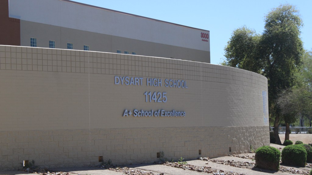 a wall with a sign for dysart high school