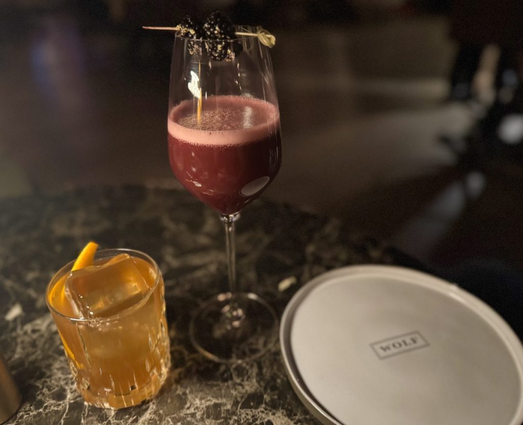 Two cocktails on a table at Wolf by Vanderpump in Scottsdale.