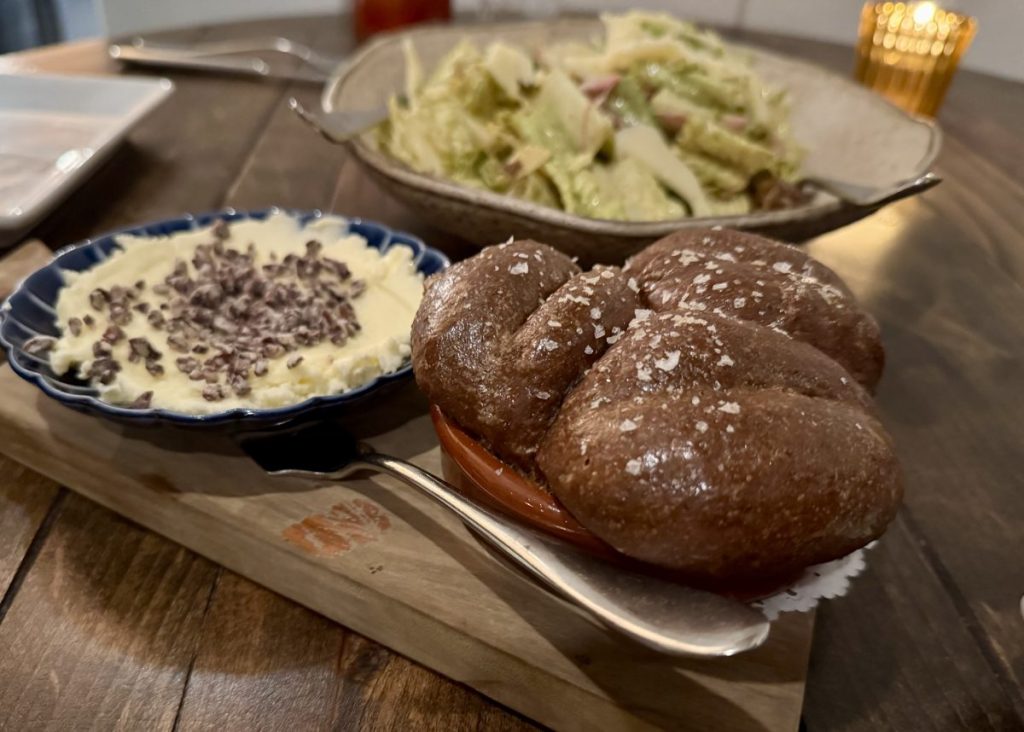 Cacao Bread and butter on a cutting board at Tandy's.