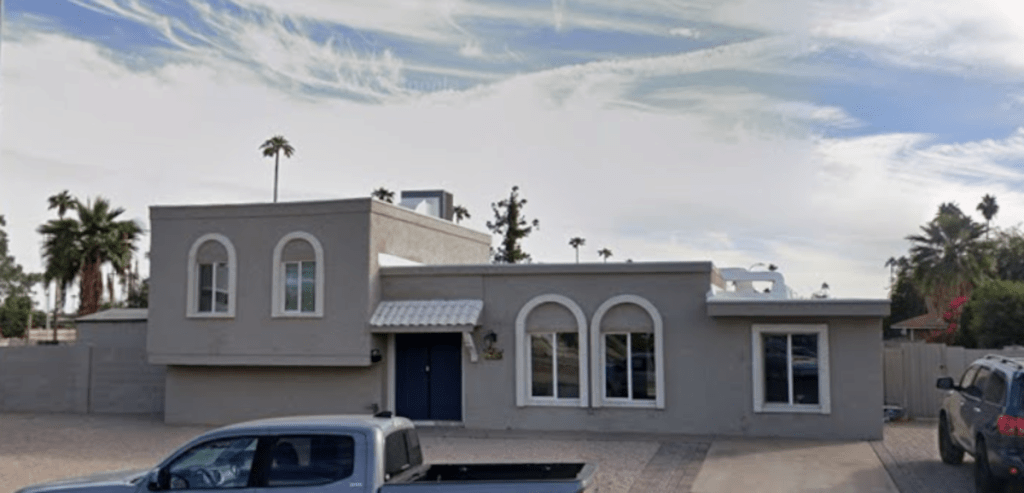 a gray, square house