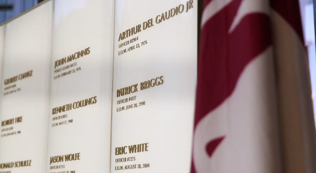 a wall featuring the names of phoenix police officers killed in the line of duty