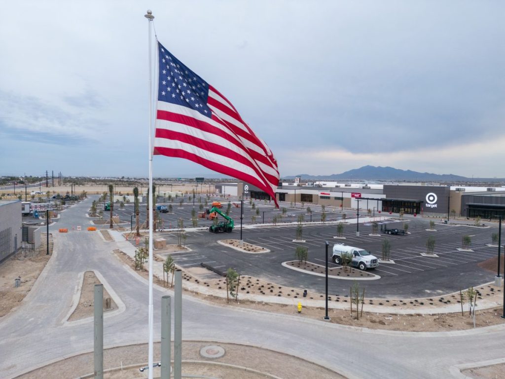 An aerial view of Verrado Marketplace, with an American flag in view.