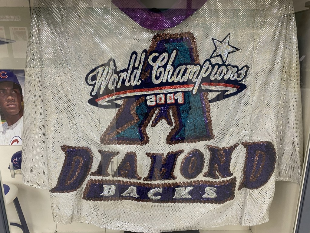 The sequined cape worn by Baxter the Bobcat during the Arizona Diamondbacks’ 2001 World Series celebration on display at the Arizona Baseball Museum in Mesa.
