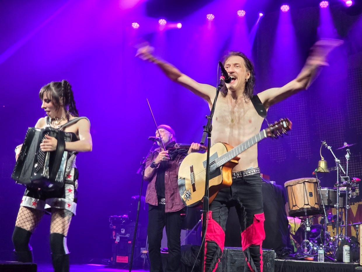 Erica Mancini, Sergey Ryabtsev and Eugene Hütz play during a Gogol Bordello set