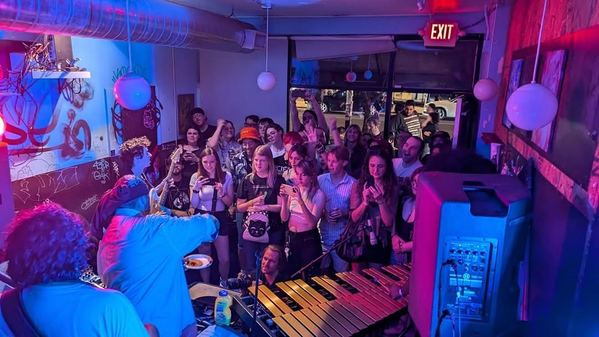 Dozens of people watch a band perform at Phoenix gallery and venue MySpace.