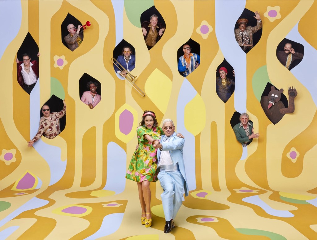 Pink Martini band members in a colorful retro-style promotional photo for their 2026 tour.