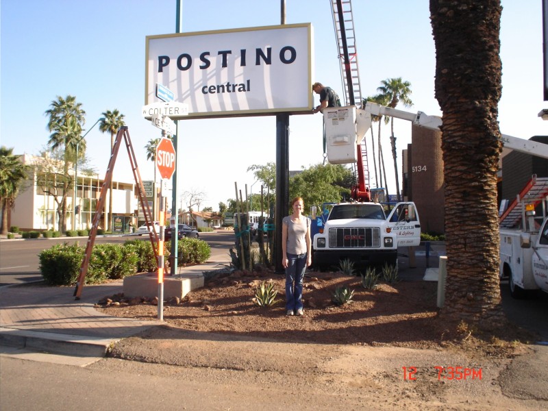 Lauren Bailey stands in front of the Postino Central sign