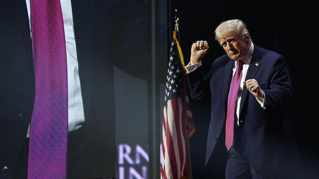 donald trump dances on a stage