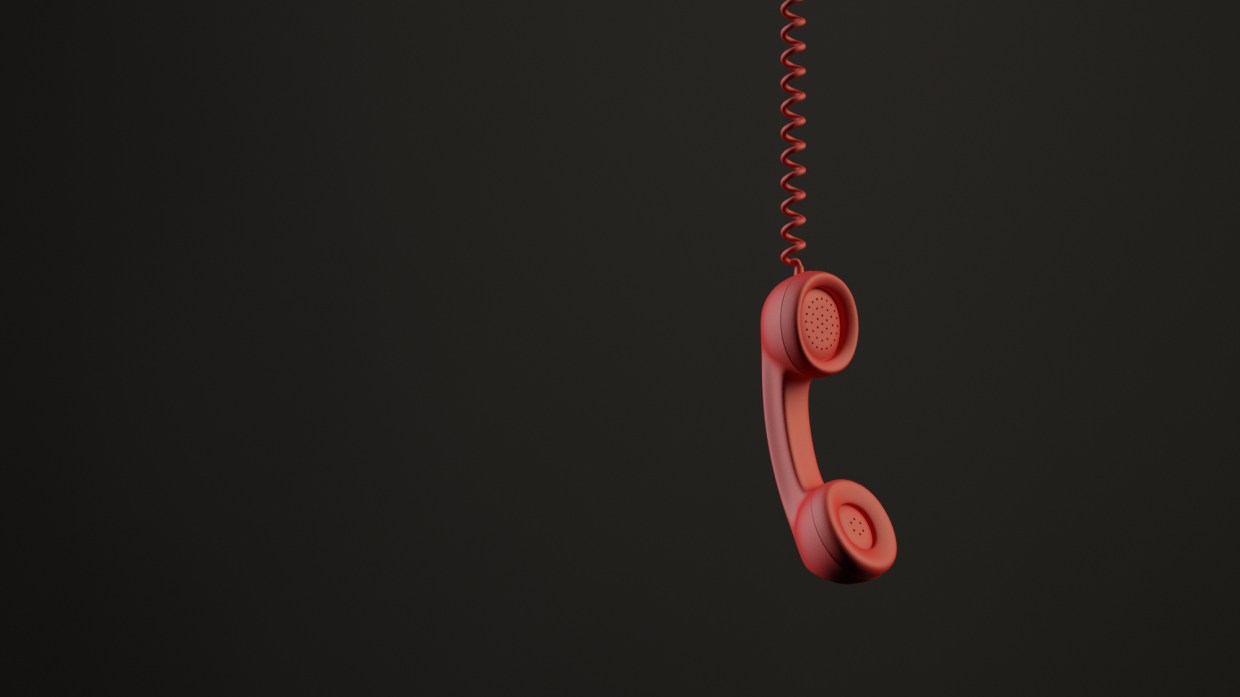 a hanging red phone receiver