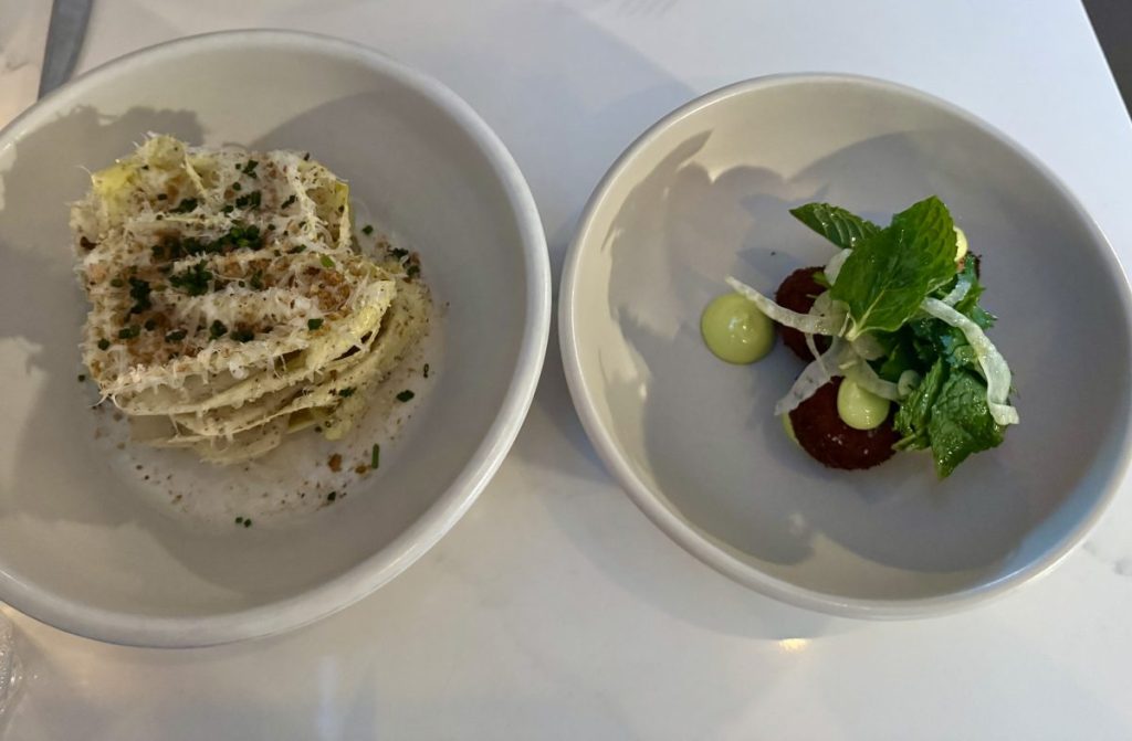 An endive Caesar salad and pollo croquettes from Restaurant Progress
