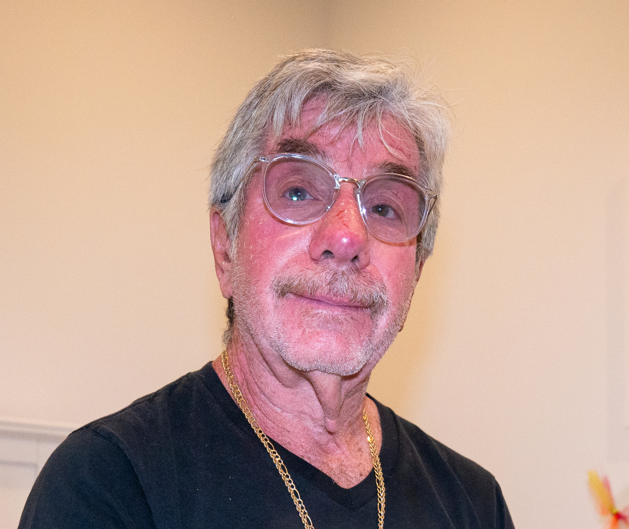 michael marion, in a black shirt and glasses