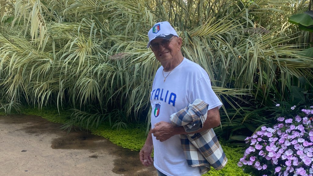 tom garro in a white shirt and hat