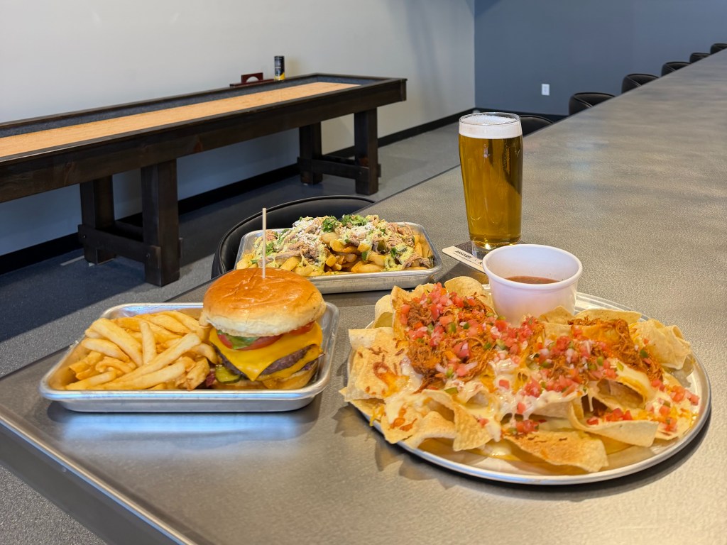 Platters with loaded fries, a burger and nachos from Head Right Brewing Co.
