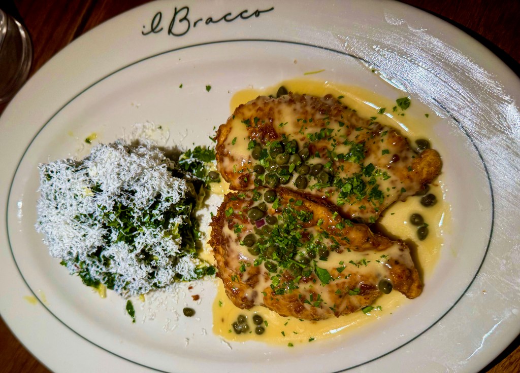 A platter of chicken piccata, with a kale salad, from il Bracco.