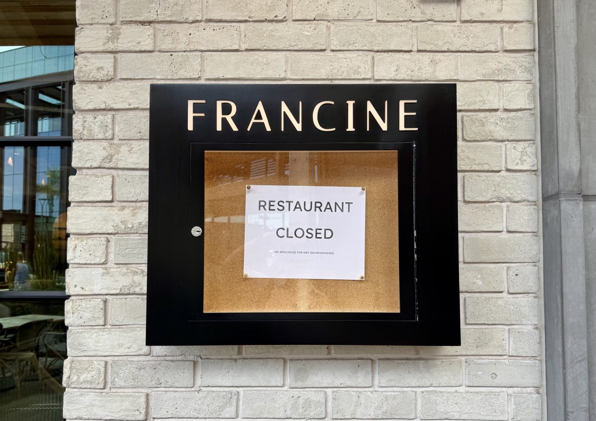 A sign reading "restaurant closed" pinned instead the menu display case of Francine.