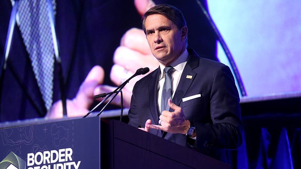todd blanche speaks at a podium