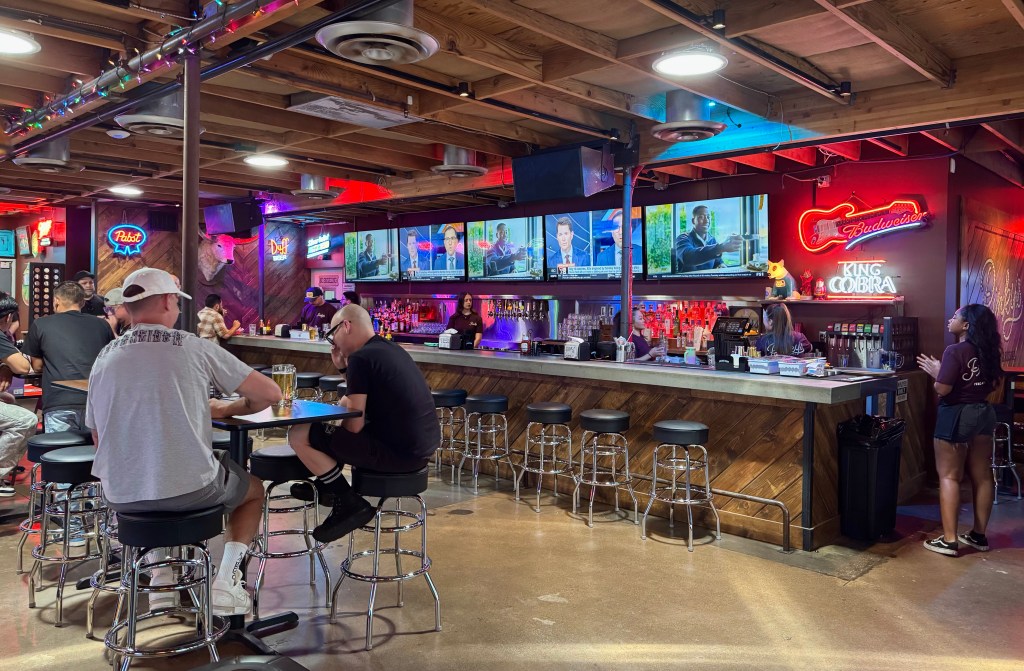 A view of the bar and TVs at Pinky's.