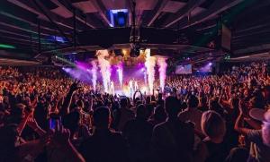 A packed crowd surrounds the rotating stage during a concert at Celebrity Theatre in Phoenix. The venue will host dozens of concerts in 2026.