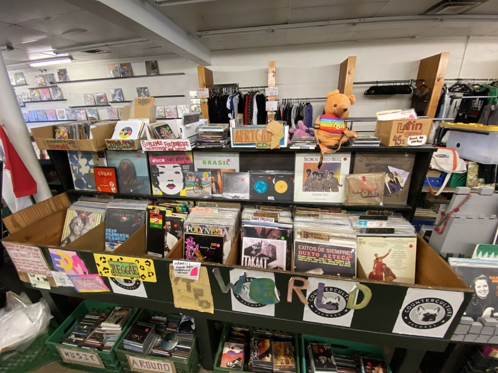 Vinyl albums line the bins inside The Ghost of Eastside Records in Tempe as customers browse before the longtime shop's impending closure.