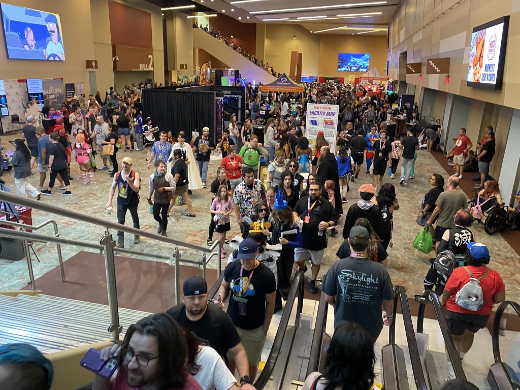 A large crowd gathered in the lower level of the Phoenix Convention Center during Phoenix Fan Fusion 2026.