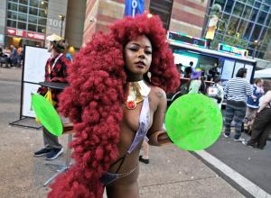 Starfire cosplayer poses outside the Phoenix Convention Center during Phoenix Fan Fusion 2026 in downtown Phoenix.