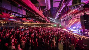 A packed crowd watches a live performance inside The Van Buren concert venue in downtown Phoenix.