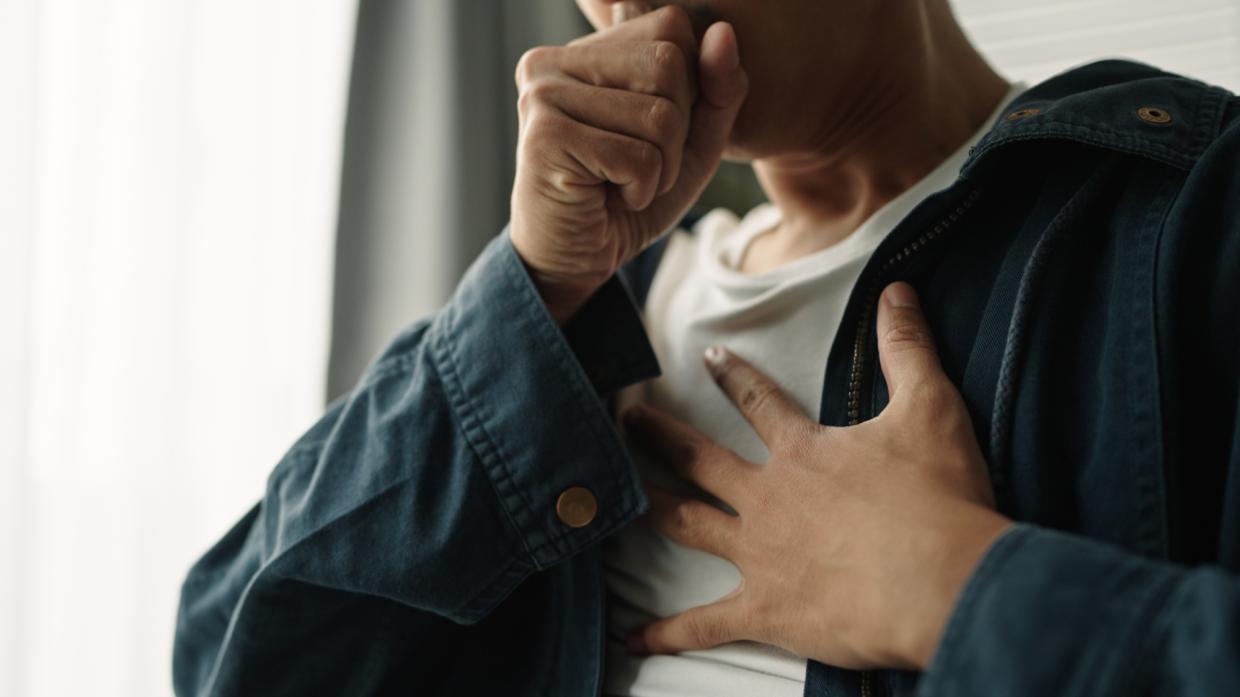 a coughing person