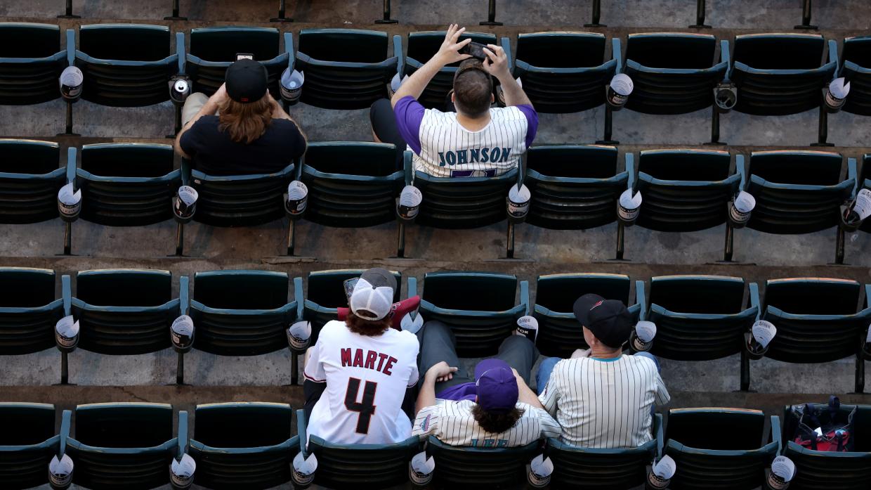 Fans look before Game Four of the World Series between the Texas Rangers and the Arizona Diamondbacks at Chase Field on October 31, 2023 in Phoenix, Arizona.